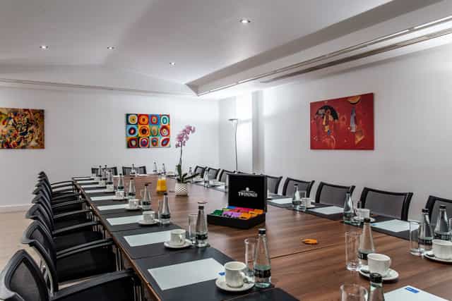Gallery Room in Adam House: bright meeting space with long table for professional gatherings.