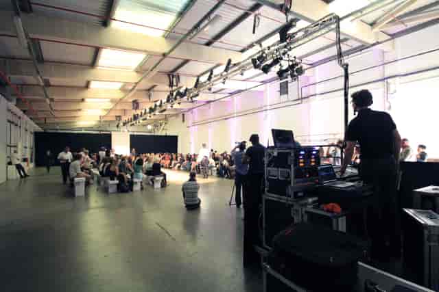 U Block event space with tiered seating, ideal for conferences and workshops.
