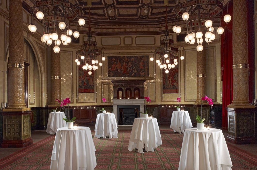 Elegant Whitehall Suite with chandeliers, perfect for networking events and receptions.