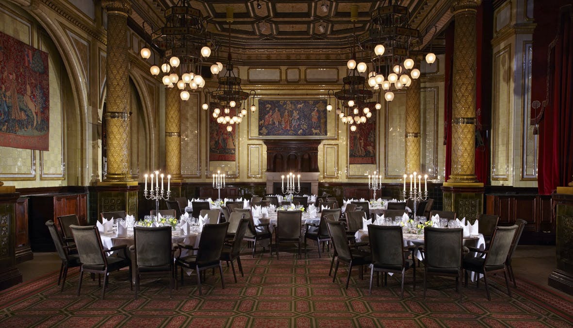 Elegant Whitehall Suite banquet hall with chandeliers for upscale events and corporate gatherings.