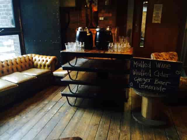 Cozy event space at The Baltic Social with rustic decor, ideal for gatherings and networking.