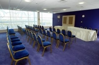 Rowley Suite at King Power Stadium, blue chairs, ideal for corporate events and workshops.