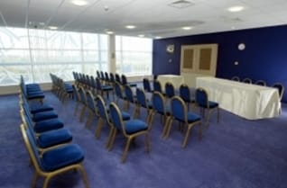Rowley Suite at King Power Stadium, bright meeting room for seminars and presentations.