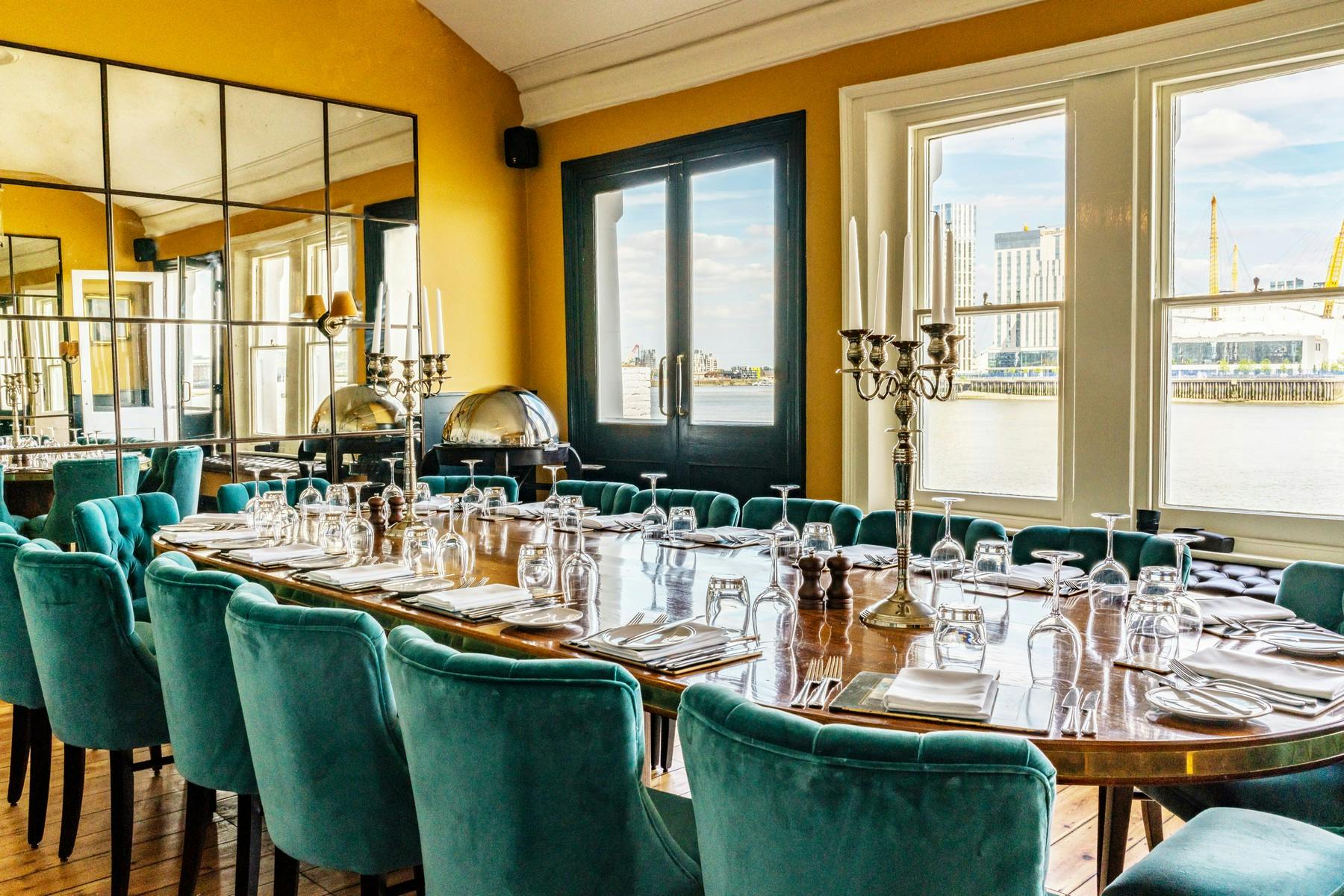 Elegant dining room with round table, ideal for upscale events and corporate dinners.