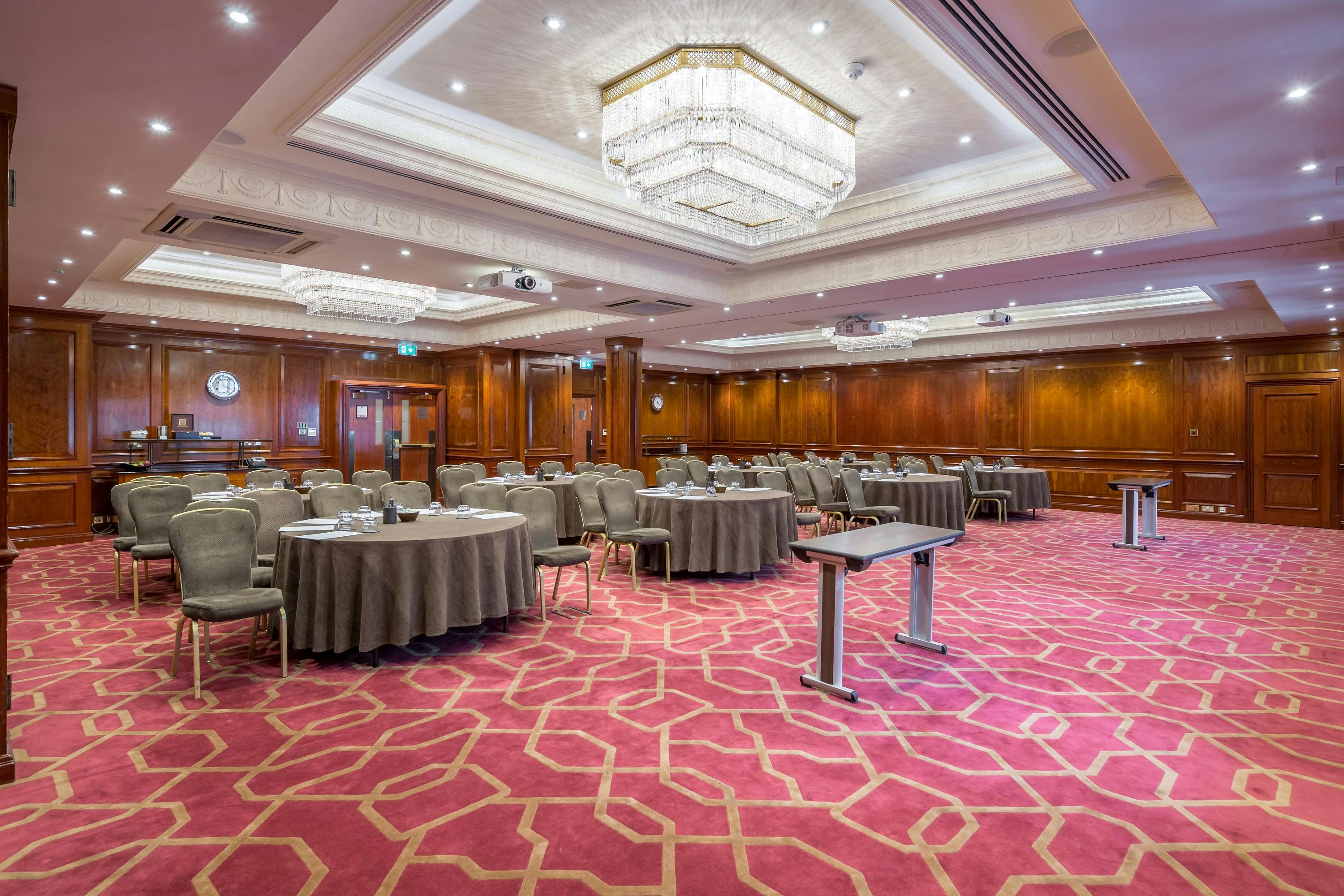 Connaught meeting room at Radisson Blu Heathrow, elegant wood paneling for corporate events.